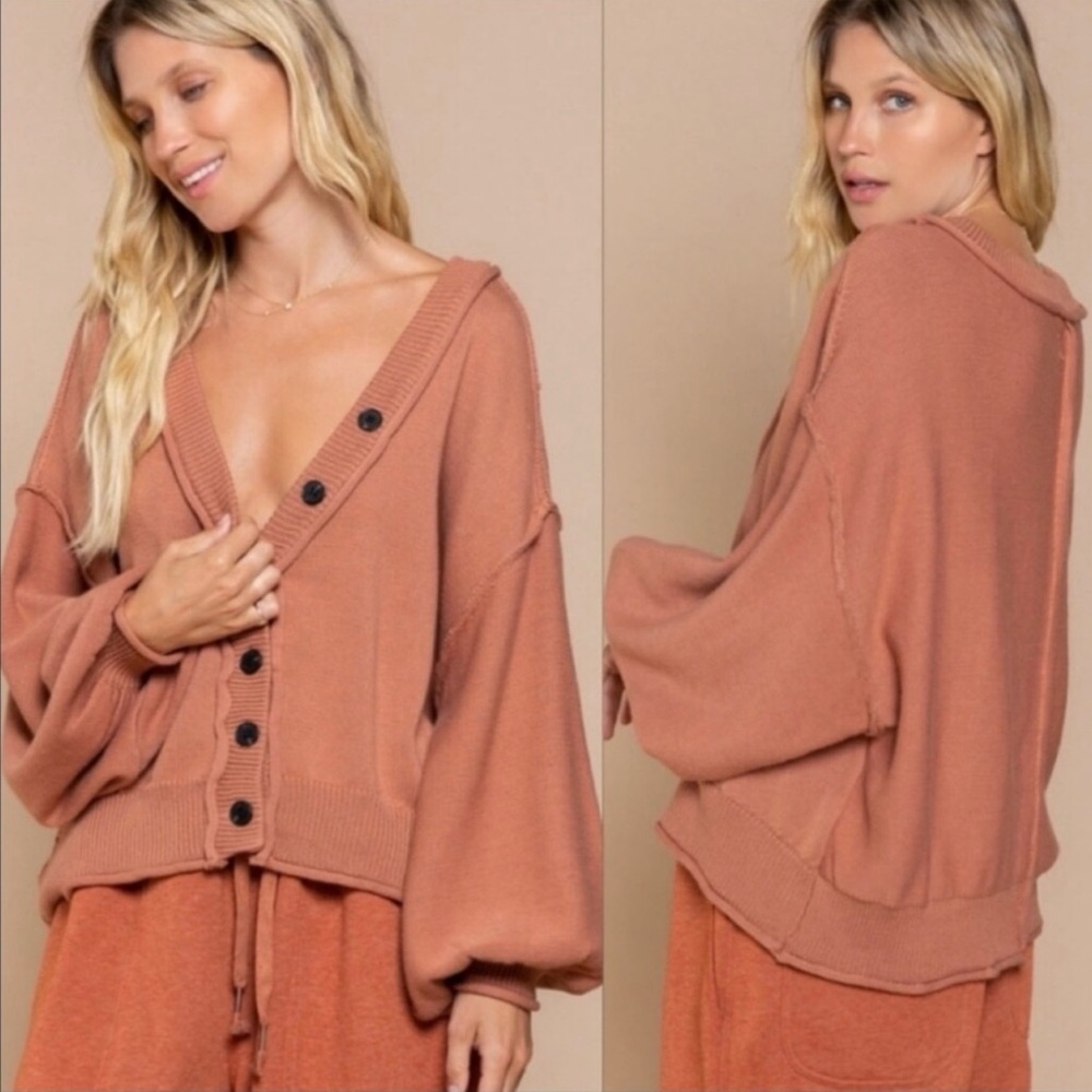 Women's oversized Sweater Cardigan with exaggerated oversized sleeves.